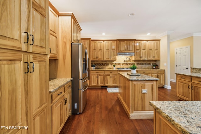 371 Pin Oak Dr, Rockwood, TN 37854 - kitchen with appliances with stainless steel finishes, under cabinet range hood, tasteful backsplash, crown molding, and a center island