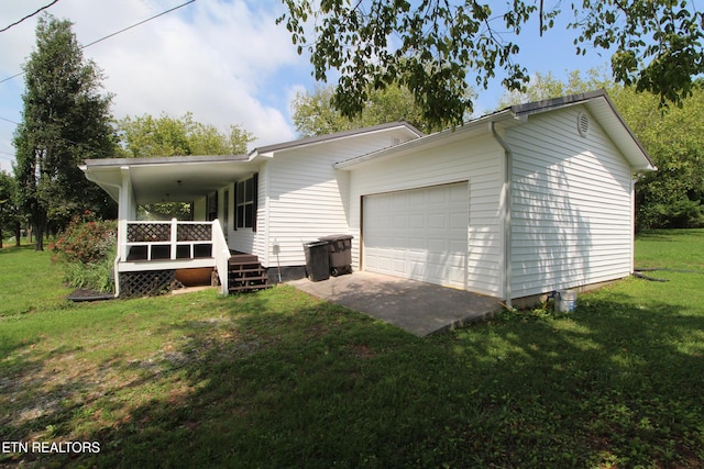 228 Pedigo Rd, Madisonville, TN 37354 - view of side of home with an attached garage, a yard, and a wooden deck