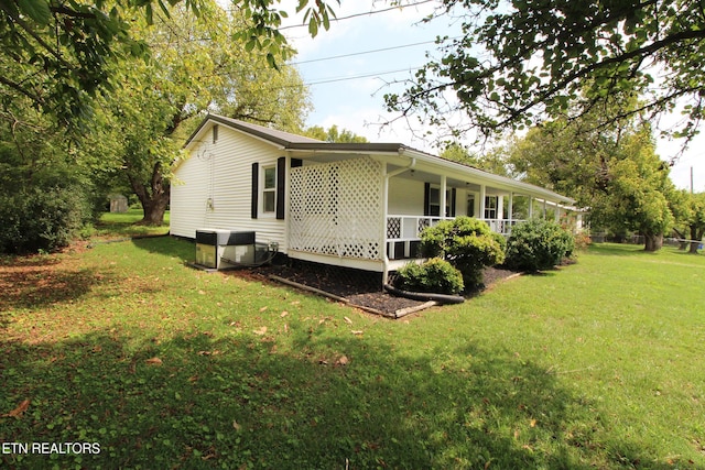 228 Pedigo Rd, Madisonville, TN 37354 - view of home's exterior with a porch and a lawn
