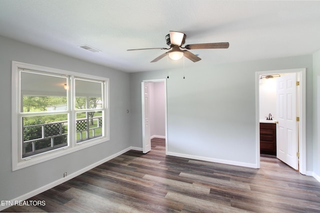 228 Pedigo Rd, Madisonville, TN 37354 - unfurnished bedroom with dark wood-style flooring and ceiling fan