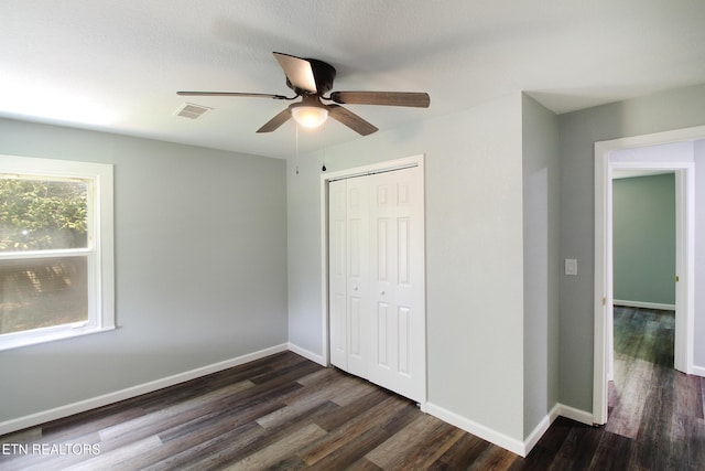 228 Pedigo Rd, Madisonville, TN 37354 - unfurnished bedroom with dark wood-style floors, a closet, and a ceiling fan