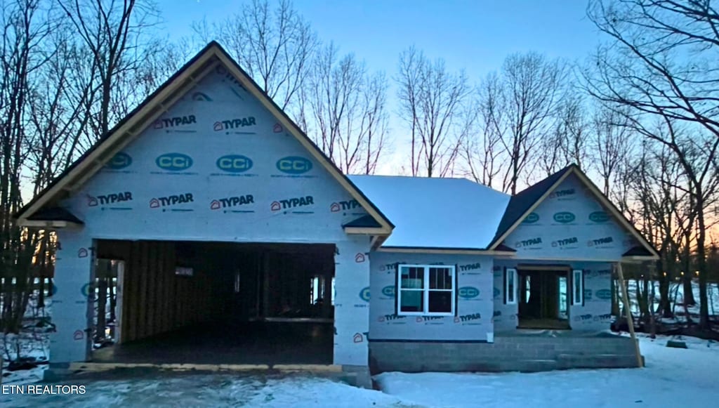 property in mid-construction with a garage