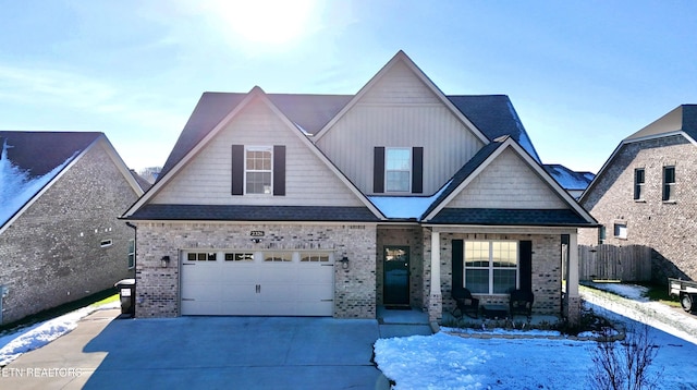 view of front of home featuring a porch and a garage