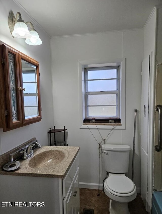 bathroom with vanity and toilet