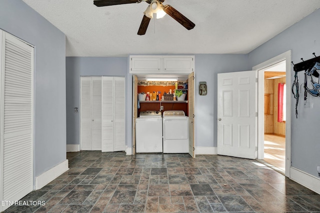 unfurnished bedroom featuring ceiling fan, a textured ceiling, washer and dryer, and multiple closets