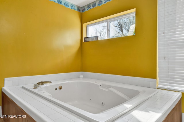 bathroom featuring a relaxing tiled tub