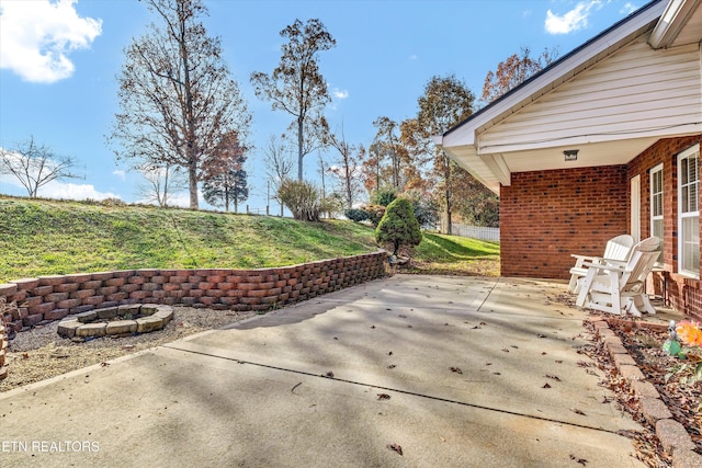 view of patio / terrace with an outdoor fire pit