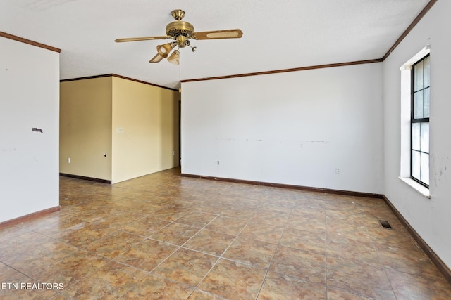 empty room featuring ceiling fan and ornamental molding