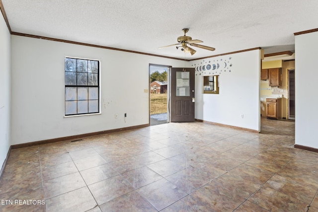 unfurnished room featuring ceiling fan, a textured ceiling, and ornamental molding