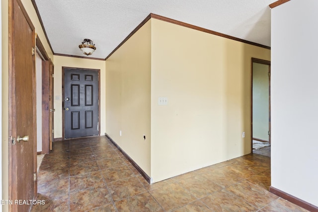 interior space with a textured ceiling and crown molding