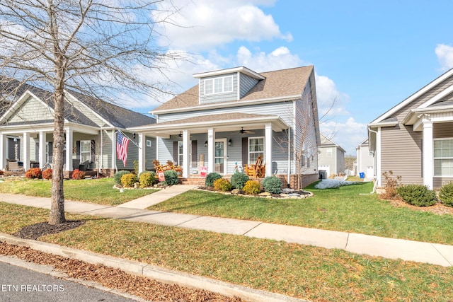 view of front of home featuring a porch and a front yard