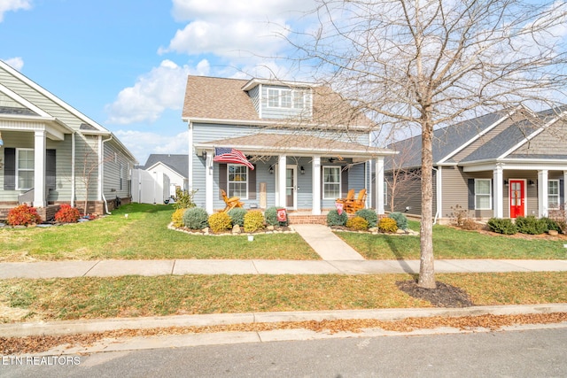 view of front of house with a front lawn and covered porch