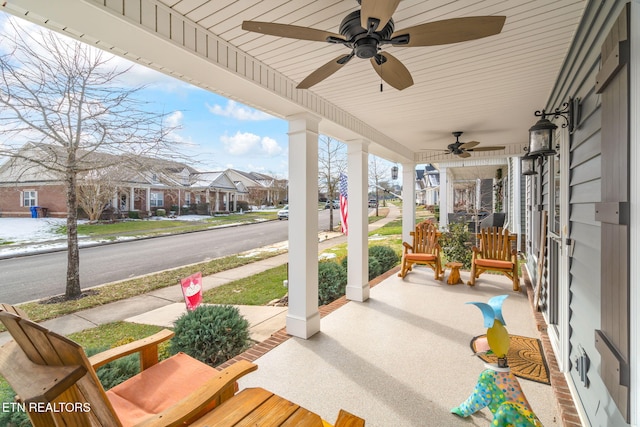 view of patio / terrace with ceiling fan and a porch