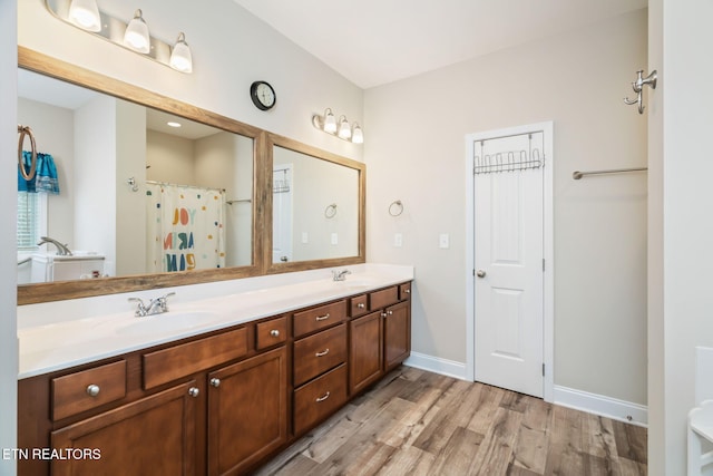 bathroom featuring vanity, a shower with shower curtain, and hardwood / wood-style floors