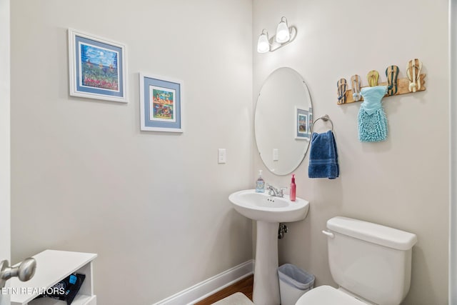 bathroom featuring sink and toilet