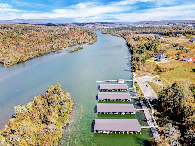 drone / aerial view featuring a water and mountain view