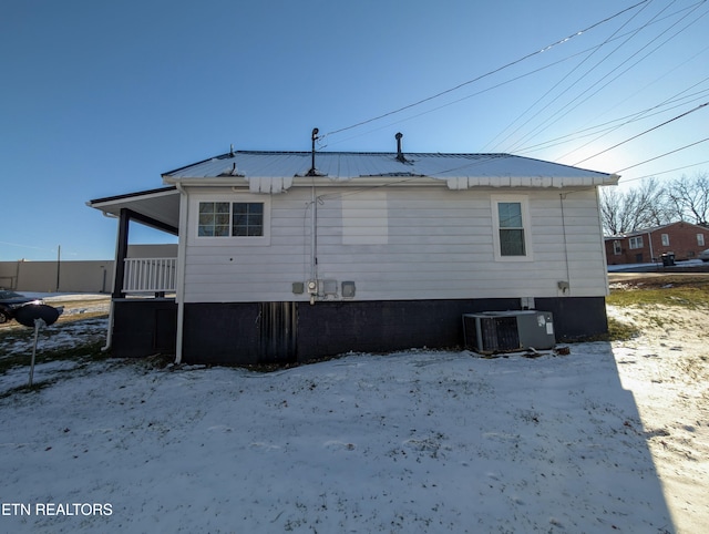 rear view of house with central AC