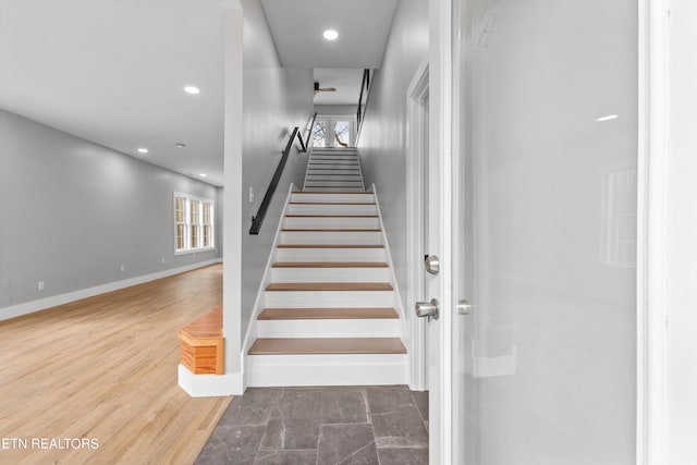 stairs with hardwood / wood-style flooring