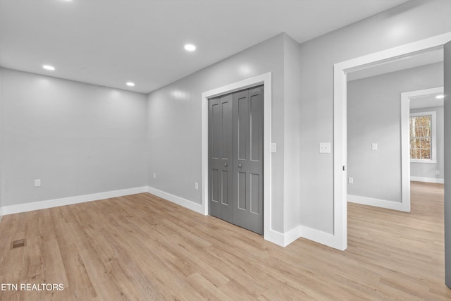 spare room featuring light hardwood / wood-style flooring