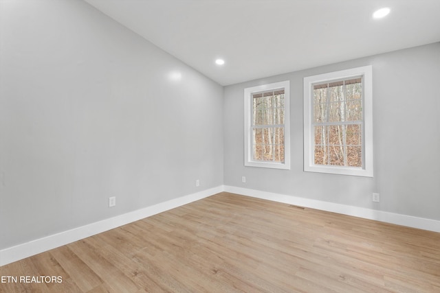 unfurnished room with light hardwood / wood-style flooring