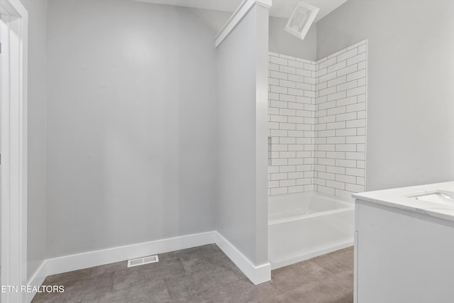 bathroom featuring vanity and tiled shower / bath combo