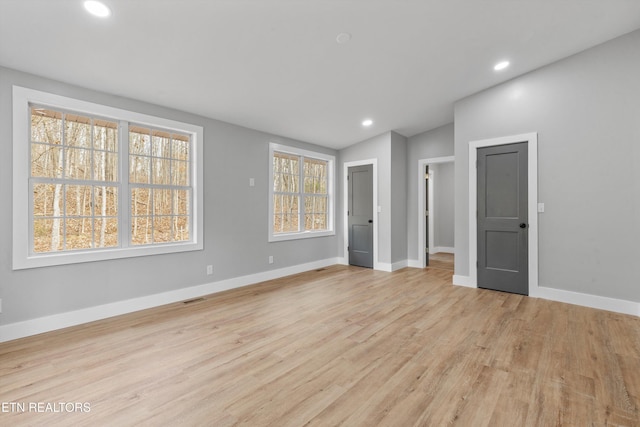 unfurnished bedroom with light hardwood / wood-style floors