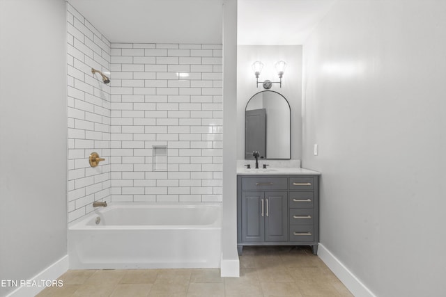 bathroom featuring vanity, tiled shower / bath combo, and tile patterned floors