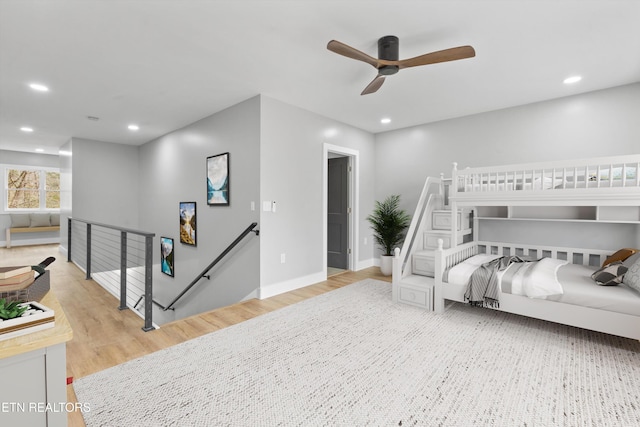 bedroom featuring ceiling fan and light hardwood / wood-style flooring