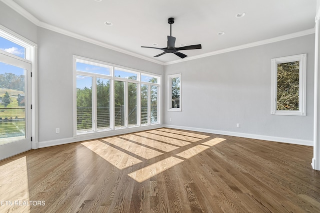 unfurnished room featuring a healthy amount of sunlight and crown molding