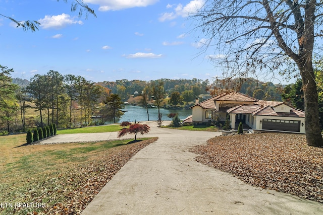 surrounding community featuring a water view