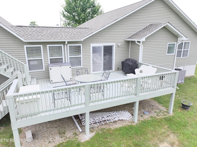 back of property featuring central AC, a yard, and a deck