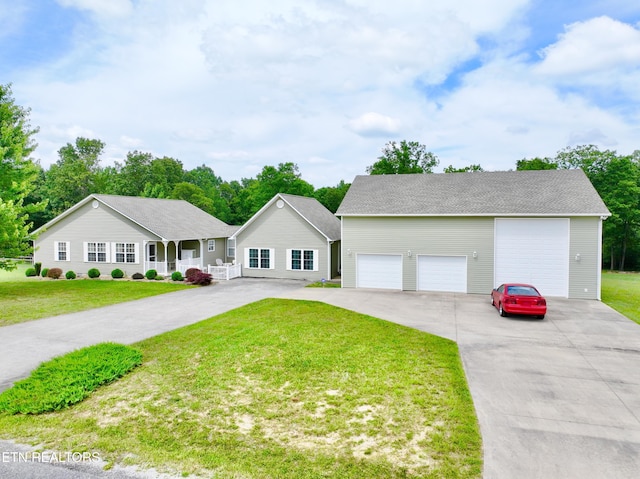 view of front of house featuring a front yard and a garage