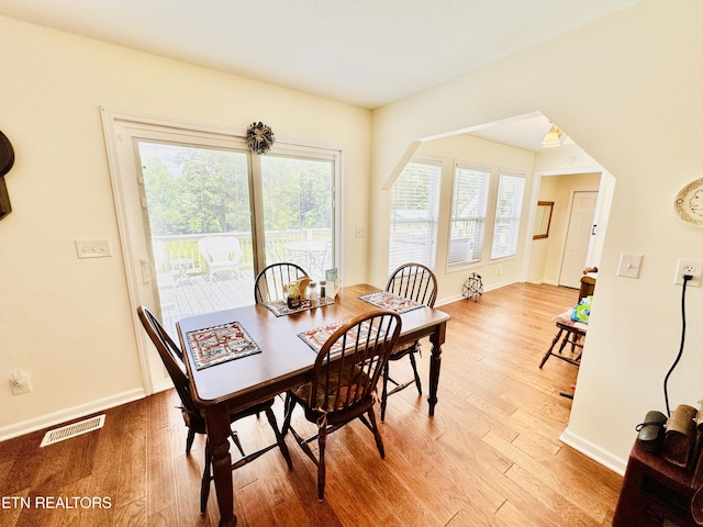 dining space featuring hardwood / wood-style floors