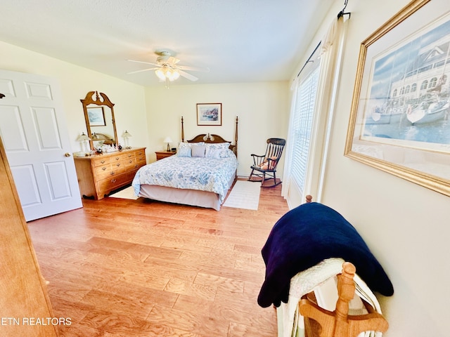 bedroom with ceiling fan and hardwood / wood-style floors