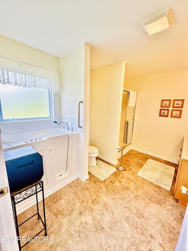 bathroom featuring toilet and plus walk in shower