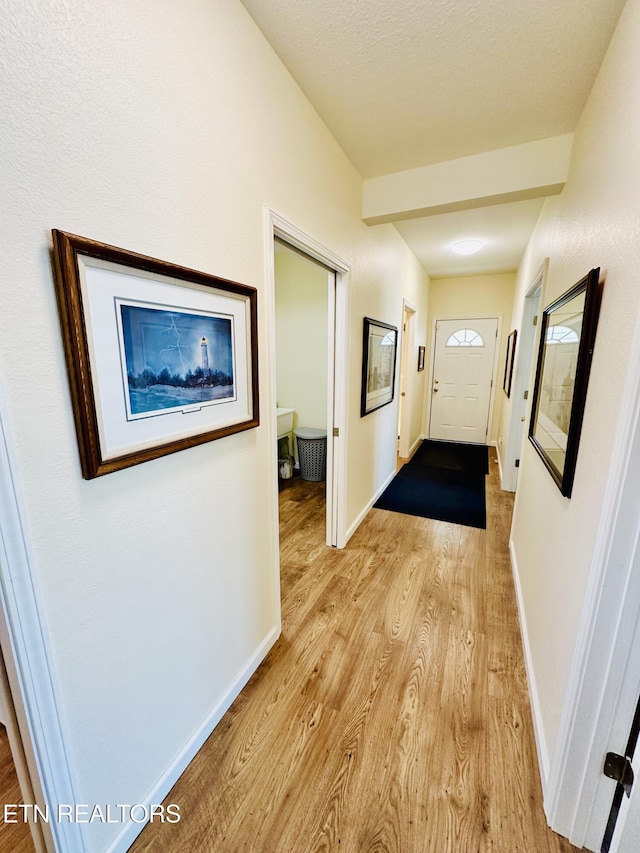 hall with light wood-type flooring