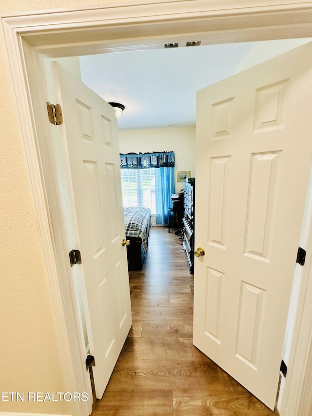 hall with light wood-type flooring