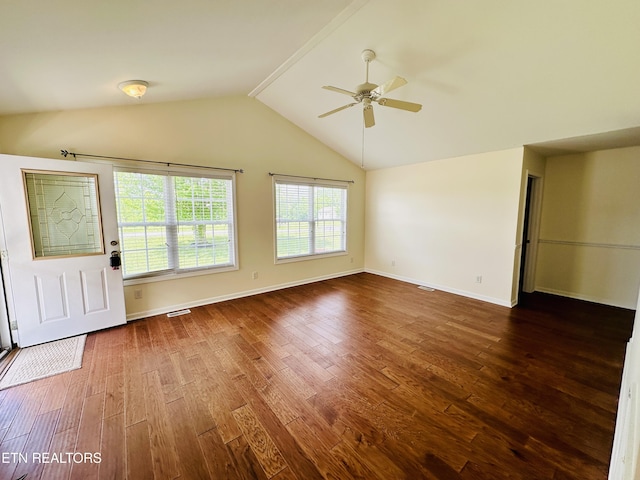 813 Clear Creek Pkwy, Clarkrange, TN 38553 - unfurnished living room featuring a ceiling fan, dark wood finished floors, vaulted ceiling, and baseboards