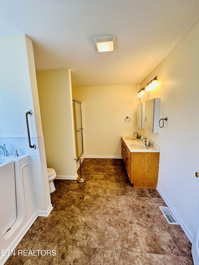 813 Clear Creek Pkwy, Clarkrange, TN 38553 - bathroom with a garden tub, toilet, vanity, a shower with door, and baseboards