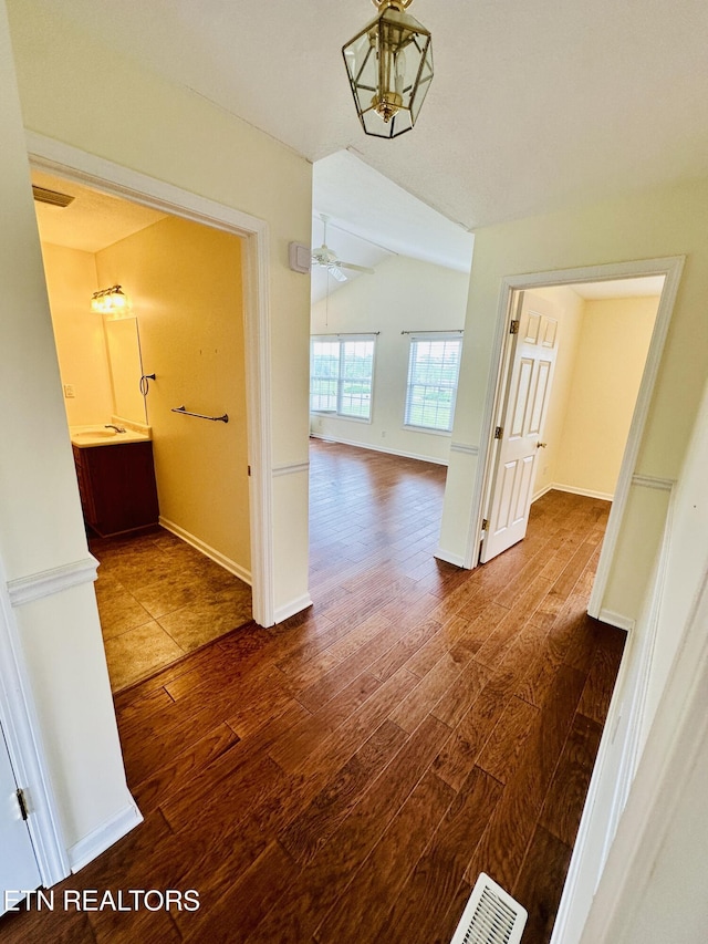 813 Clear Creek Pkwy, Clarkrange, TN 38553 - corridor with wood finished floors, lofted ceiling, and baseboards