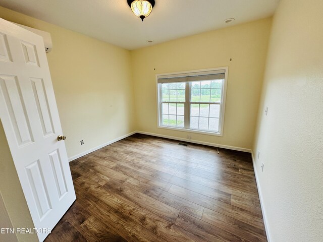 813 Clear Creek Pkwy, Clarkrange, TN 38553 - unfurnished room featuring dark wood-style flooring and baseboards