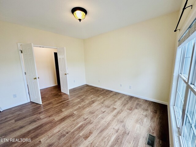 813 Clear Creek Pkwy, Clarkrange, TN 38553 - spare room with wood finished floors and baseboards