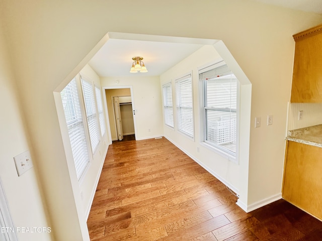 813 Clear Creek Pkwy, Clarkrange, TN 38553 - unfurnished dining area with hardwood / wood-style flooring and baseboards