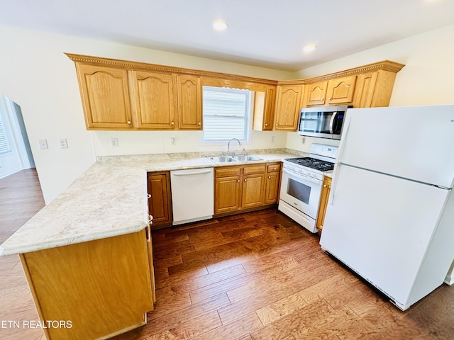 813 Clear Creek Pkwy, Clarkrange, TN 38553 - kitchen with white appliances, a sink, dark wood-style flooring, a peninsula, and recessed lighting