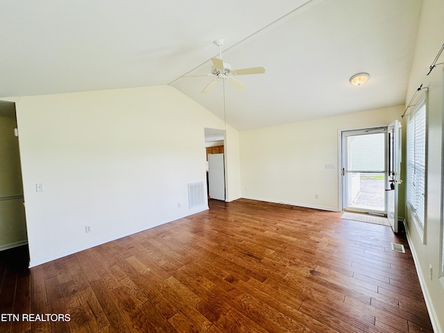 813 Clear Creek Pkwy, Clarkrange, TN 38553 - unfurnished room with a ceiling fan, dark wood-type flooring, vaulted ceiling, and baseboards