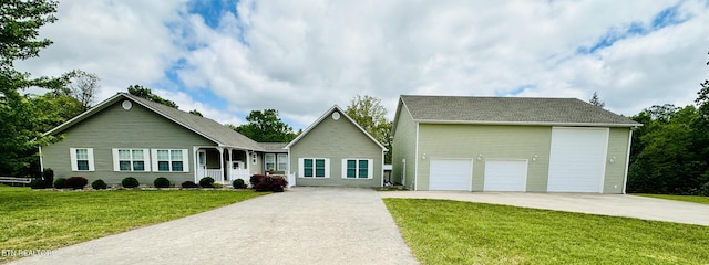 813 Clear Creek Pkwy, Clarkrange, TN 38553 - single story home with a front lawn, a garage, an outbuilding, and roof with shingles