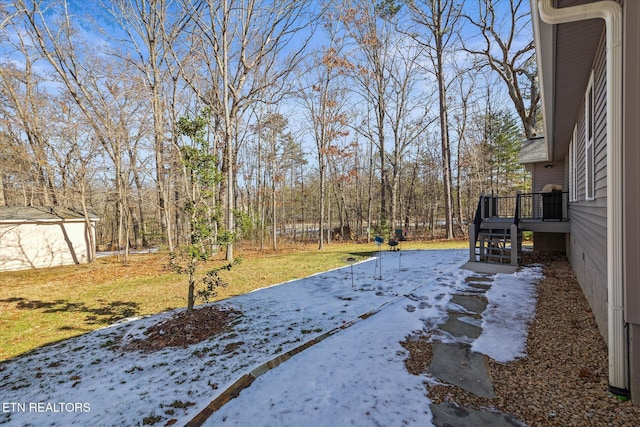 view of yard with a wooden deck