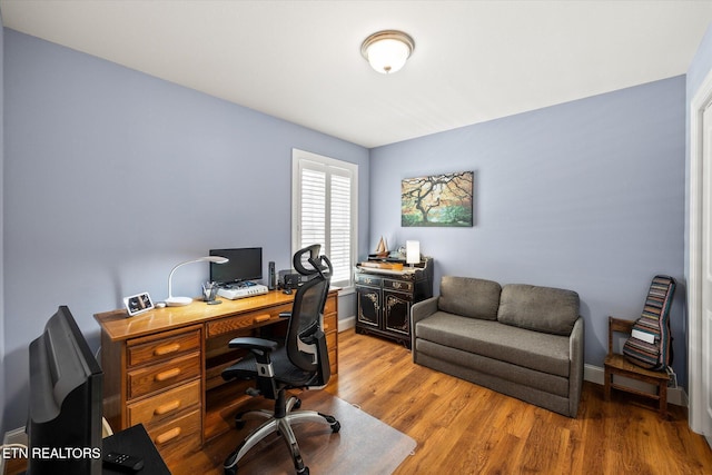 office with hardwood / wood-style floors