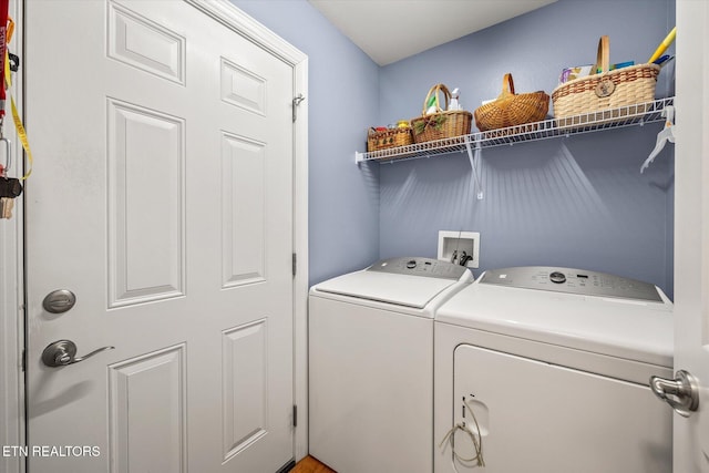 laundry area featuring washing machine and clothes dryer