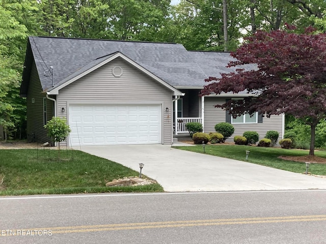 view of front of home featuring a garage and a front yard